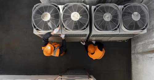 men-working-with-equipment-full-shot